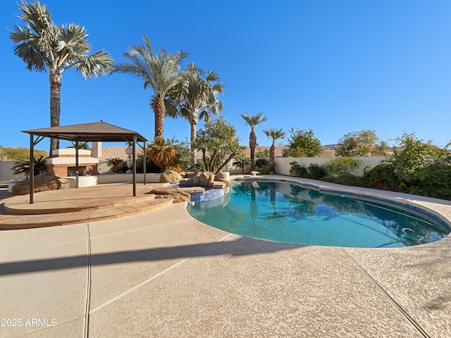 view of pool featuring a fenced in pool, a fenced backyard, a patio, and a gazebo