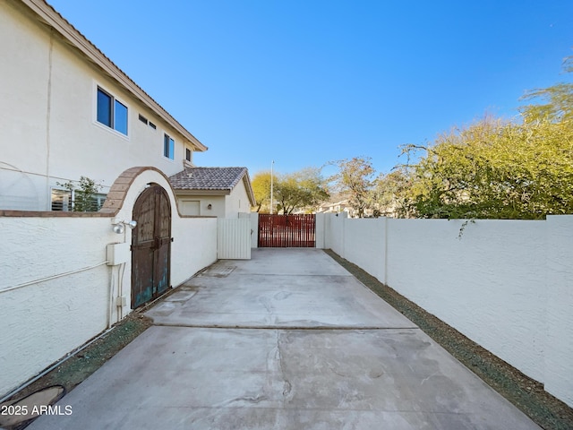 view of patio featuring fence private yard and a gate