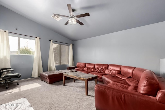 living area featuring lofted ceiling, carpet floors, ceiling fan, and visible vents