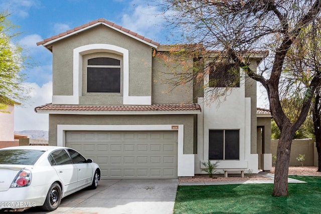 mediterranean / spanish home with driveway, an attached garage, a tile roof, and stucco siding