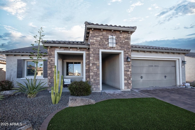 mediterranean / spanish-style home with a garage