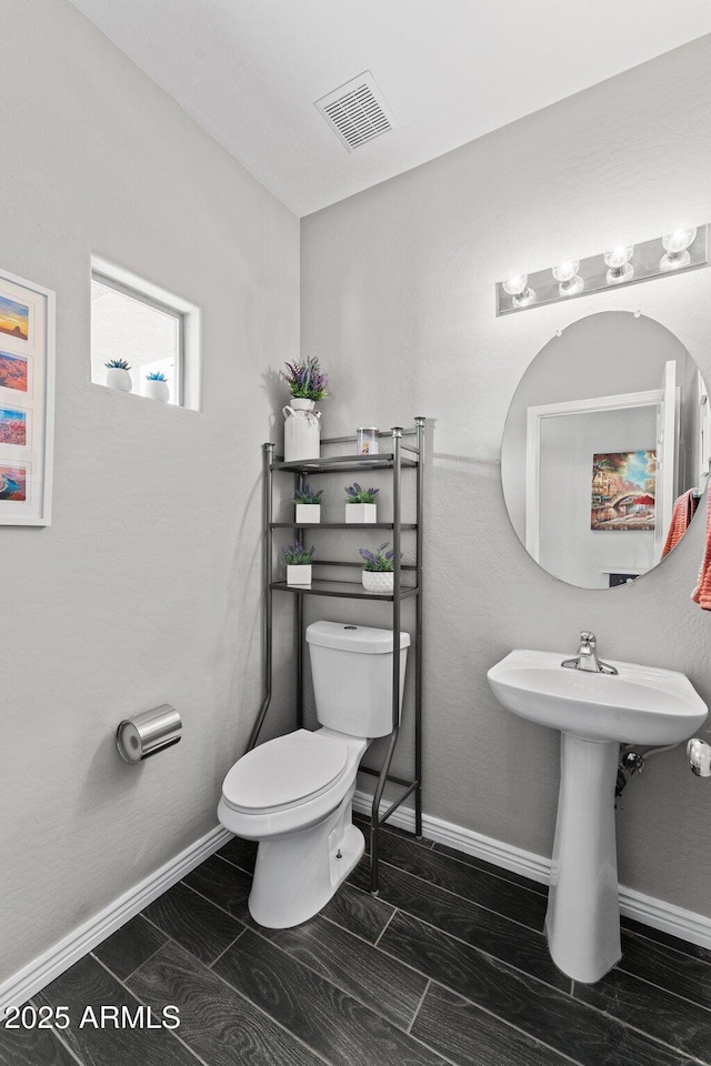 bathroom with sink and toilet