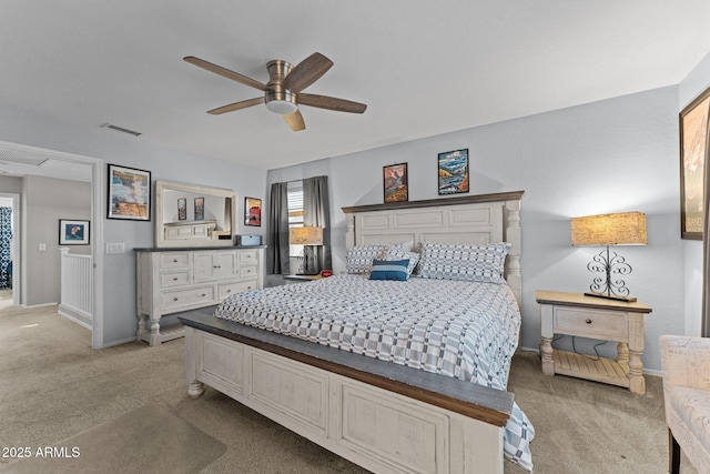 bedroom featuring light carpet and ceiling fan