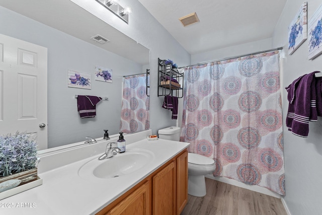 bathroom with vanity, hardwood / wood-style floors, toilet, and a shower with shower curtain