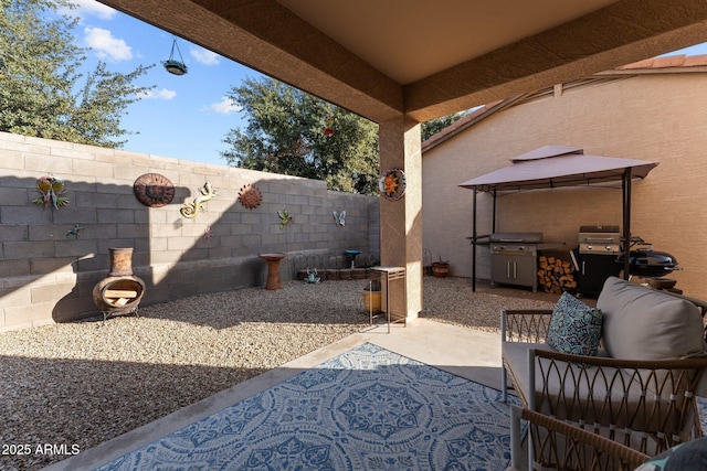 view of patio with a gazebo and a grill