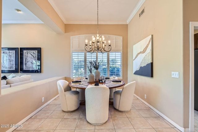 dining room featuring a notable chandelier, crown molding, and light tile patterned flooring