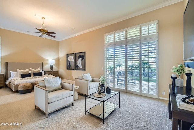 living room with ornamental molding, carpet flooring, and ceiling fan