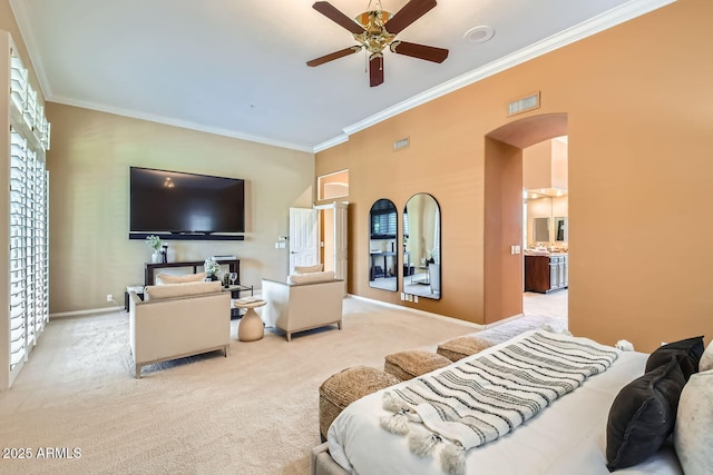 bedroom with ornamental molding and light carpet