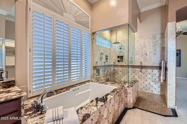 bathroom with vanity, crown molding, and plus walk in shower