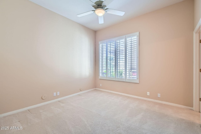 unfurnished room featuring light colored carpet and ceiling fan