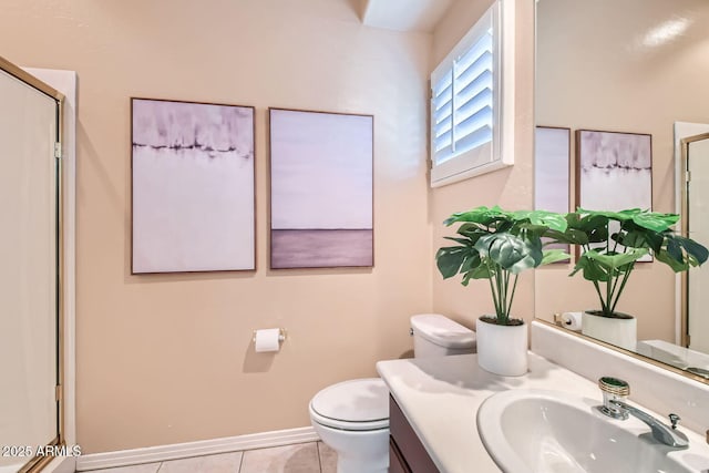 bathroom featuring an enclosed shower, vanity, tile patterned floors, and toilet