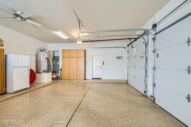 garage with a garage door opener, water heater, ceiling fan, and white fridge