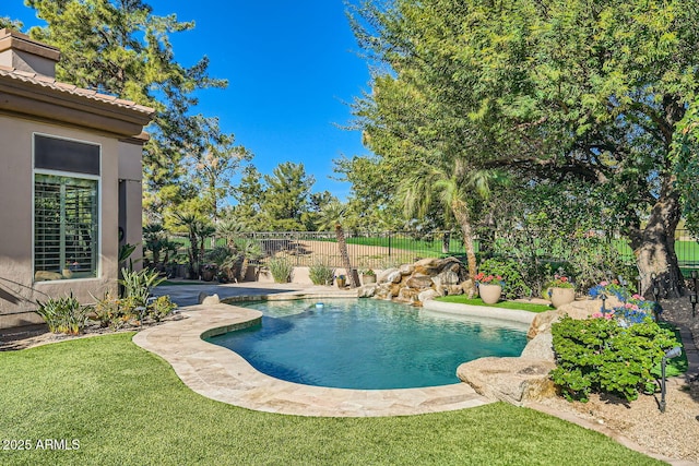 view of pool featuring a yard and a patio