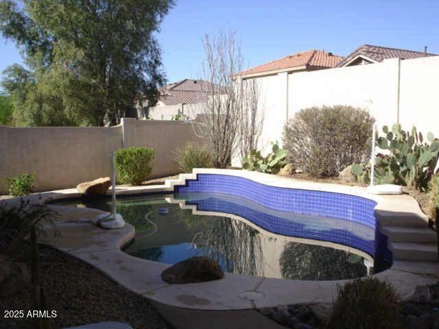 view of pool with a fenced in pool and a fenced backyard