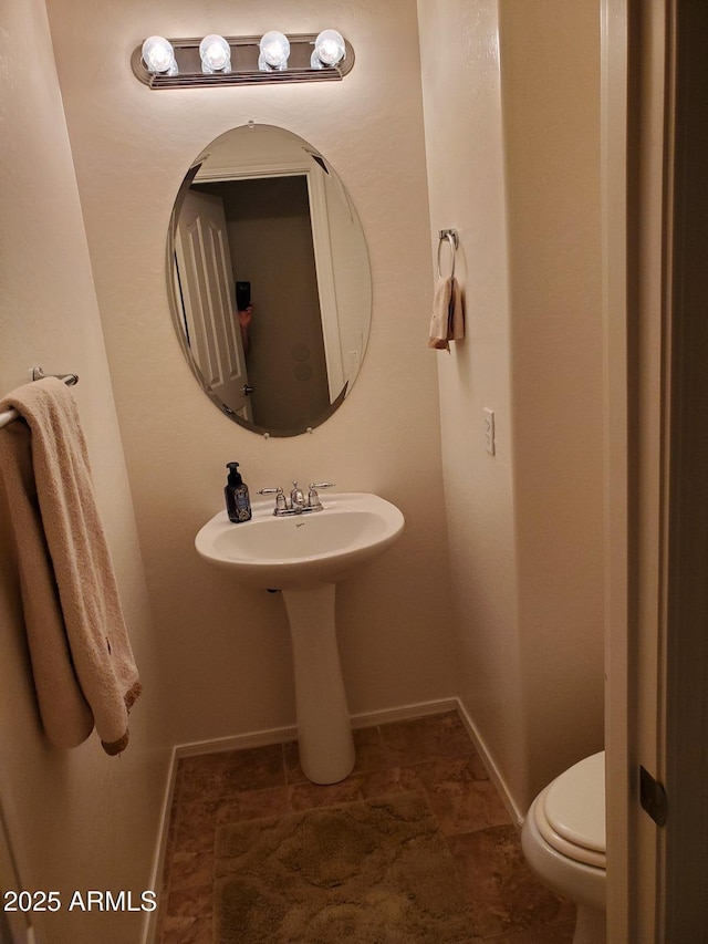 bathroom featuring toilet