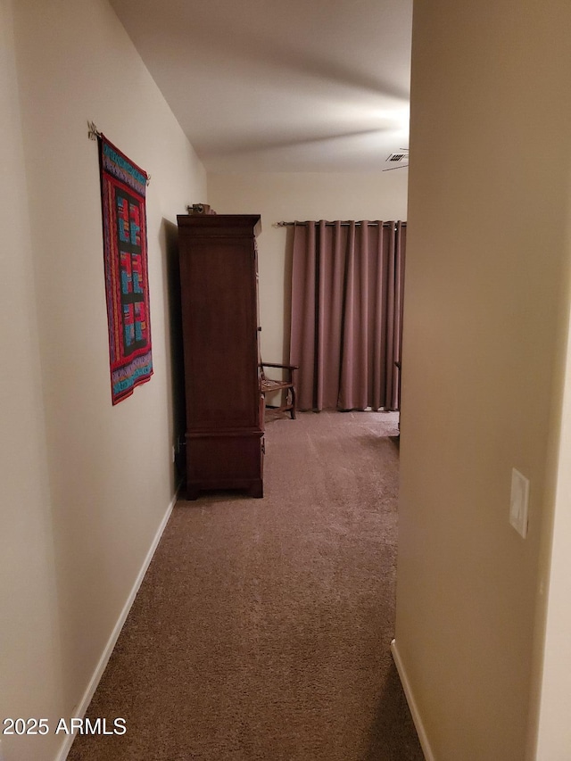 hallway with carpet flooring