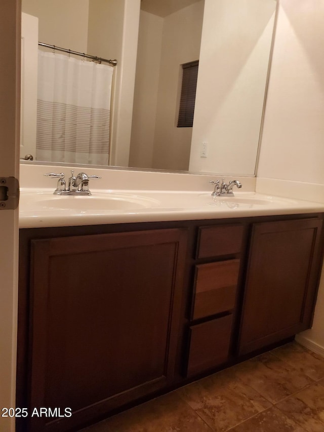 bathroom with vanity and tile patterned floors