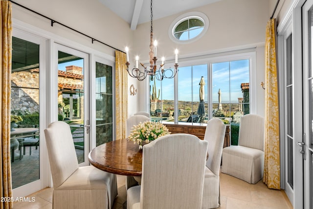 tiled dining area with a notable chandelier, vaulted ceiling with beams, and plenty of natural light