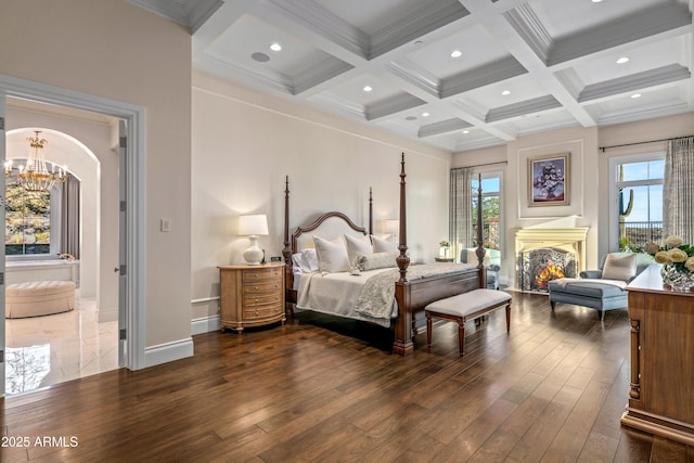 bedroom featuring coffered ceiling, dark hardwood / wood-style flooring, a notable chandelier, and beam ceiling