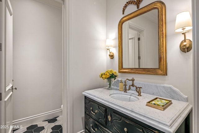 bathroom with toilet, tile patterned floors, and vanity