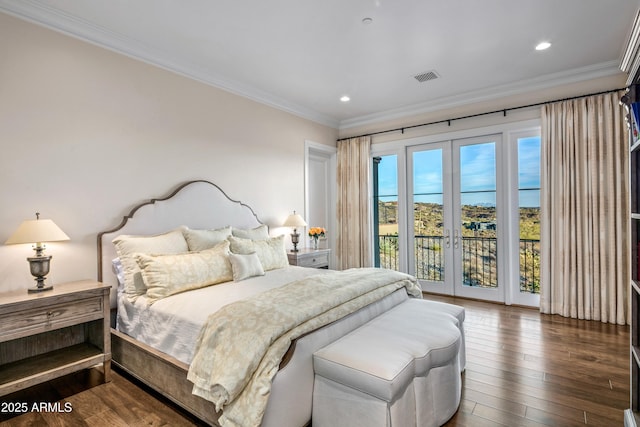 bedroom featuring dark wood-type flooring, french doors, crown molding, and access to exterior