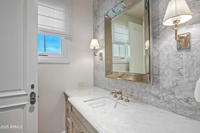 bathroom featuring tasteful backsplash and vanity