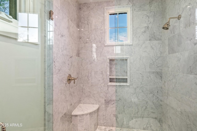 bathroom featuring tiled shower