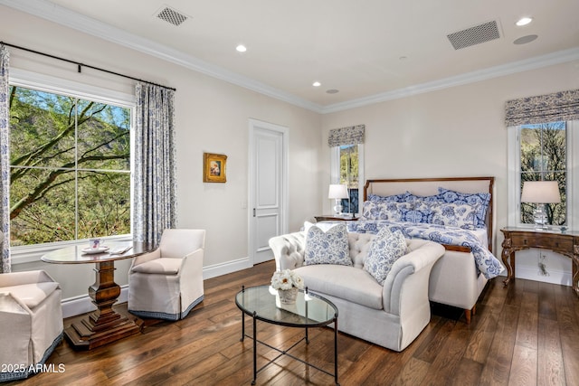 bedroom featuring ornamental molding and dark hardwood / wood-style flooring