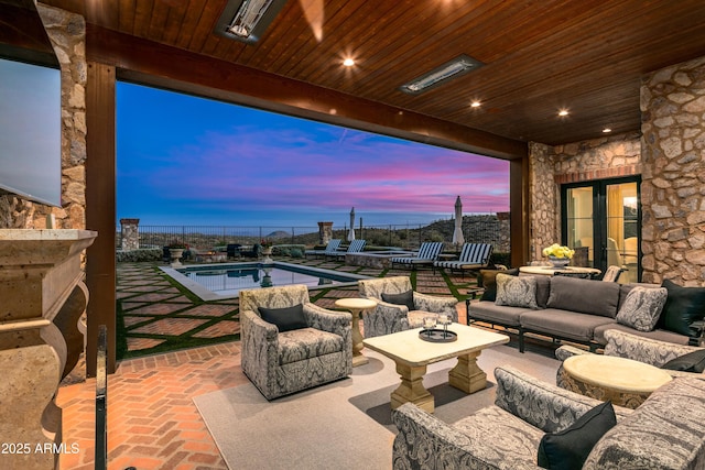 patio terrace at dusk with outdoor lounge area