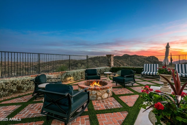 patio terrace at dusk with an outdoor fire pit