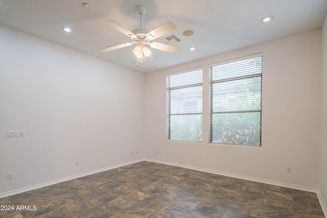 spare room featuring recessed lighting, visible vents, ceiling fan, and baseboards