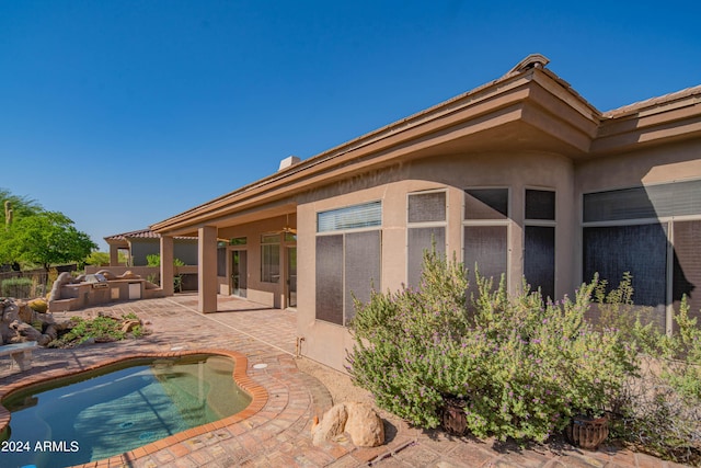 view of pool with a patio area and an outdoor kitchen