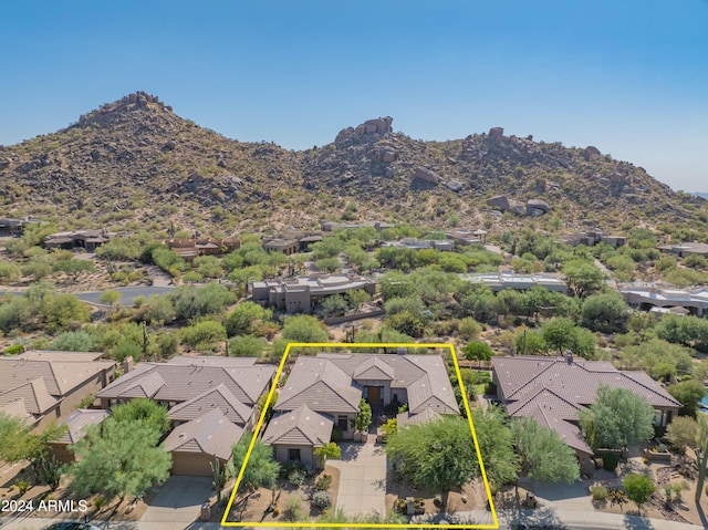 birds eye view of property with a mountain view