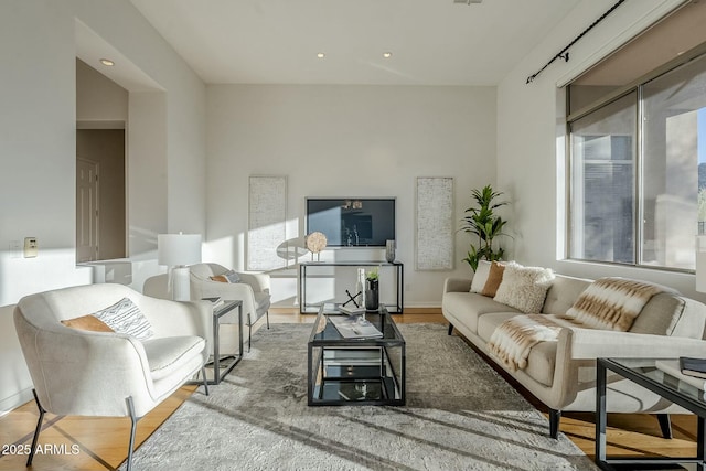 living room with wood finished floors and recessed lighting