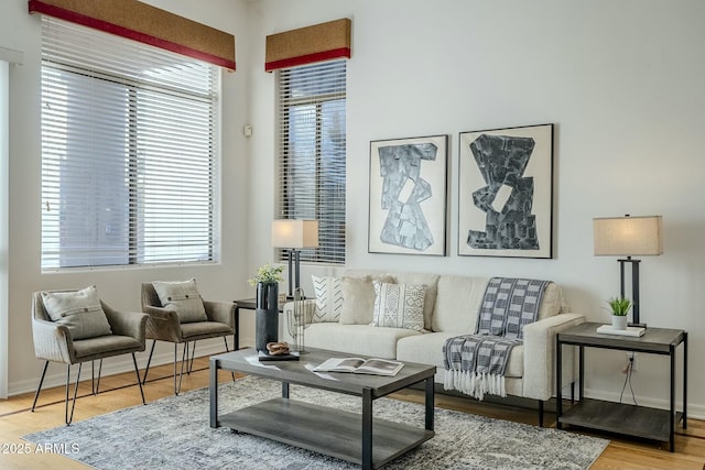 living room featuring light wood-style floors and baseboards