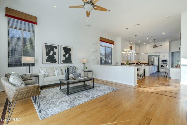 unfurnished bedroom featuring light carpet, a closet, and ceiling fan