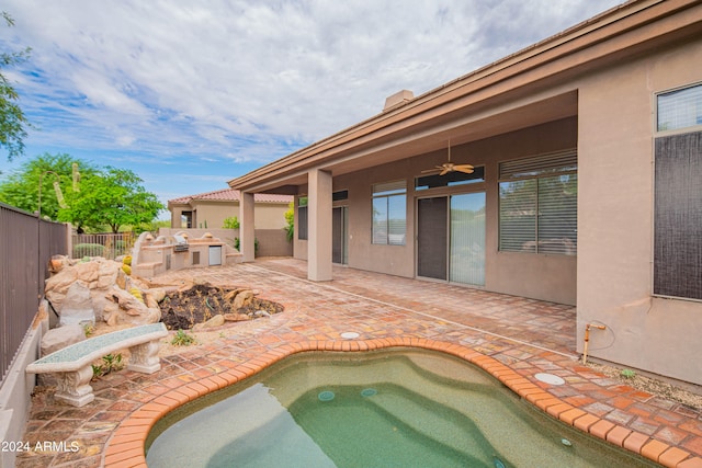 view of pool with ceiling fan, a jacuzzi, area for grilling, and a patio