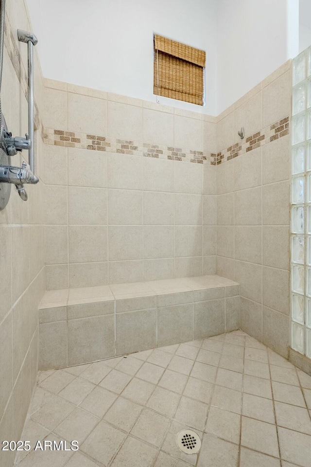 bathroom with a tile shower