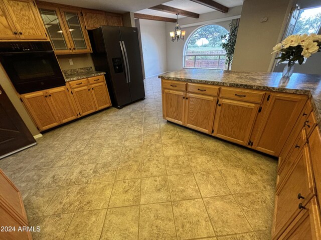 kitchen with glass insert cabinets, fridge with ice dispenser, a chandelier, beam ceiling, and black oven