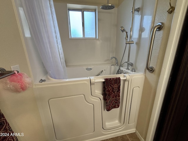 full bathroom with shower / tub combo with curtain