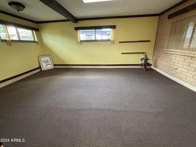 carpeted empty room with crown molding, beam ceiling, baseboards, and a baseboard radiator