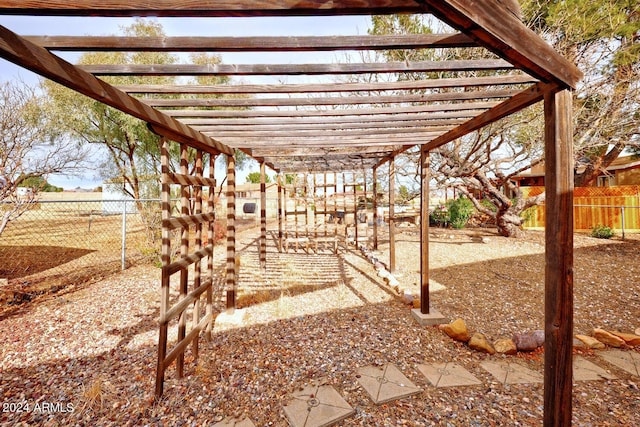 view of patio / terrace featuring fence and a pergola