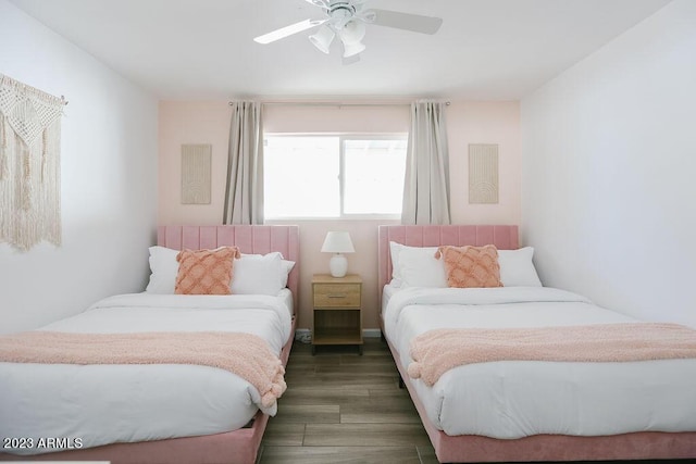 bedroom with ceiling fan and wood finished floors