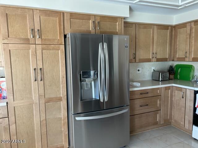 6122 E Saddleback St, Mesa, AZ 85215 - kitchen featuring stainless steel fridge, light countertops, and light tile patterned floors