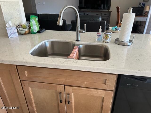 6122 E Saddleback St, Mesa, AZ 85215 - details featuring light stone counters, a sink, and dishwasher
