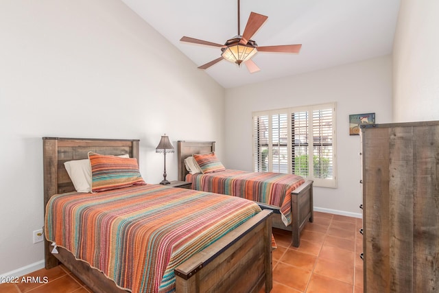 6122 E Saddleback St, Mesa, AZ 85215 - bedroom featuring light tile patterned floors, baseboards, ceiling fan, and vaulted ceiling