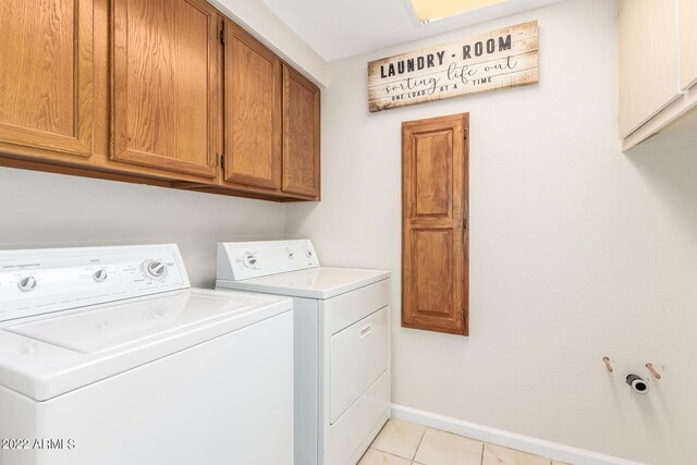 6122 E Saddleback St, Mesa, AZ 85215 - laundry room with light tile patterned floors, baseboards, cabinet space, and washing machine and clothes dryer