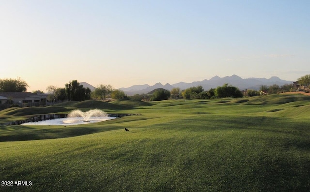 6122 E Saddleback St, Mesa, AZ 85215 - view of property's community with a lawn, a water and mountain view, and golf course view