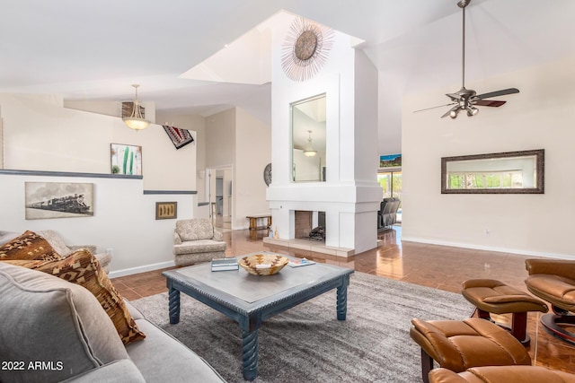 6122 E Saddleback St, Mesa, AZ 85215 - tiled living room with high vaulted ceiling, baseboards, and a ceiling fan