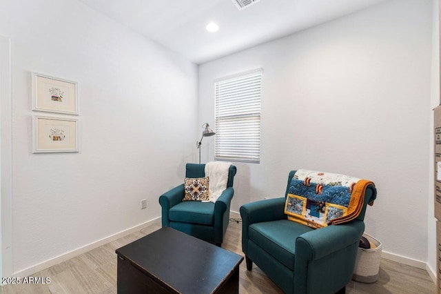 sitting room with recessed lighting, visible vents, baseboards, and wood finished floors